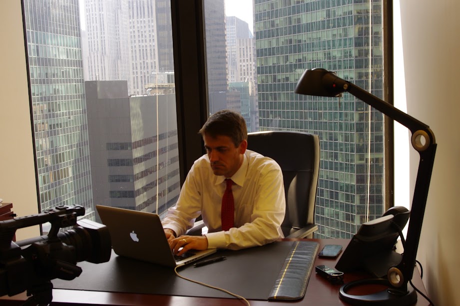 Sam at work in a downtown office