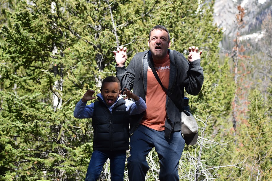 Sam and his son clowning around on a nature walk