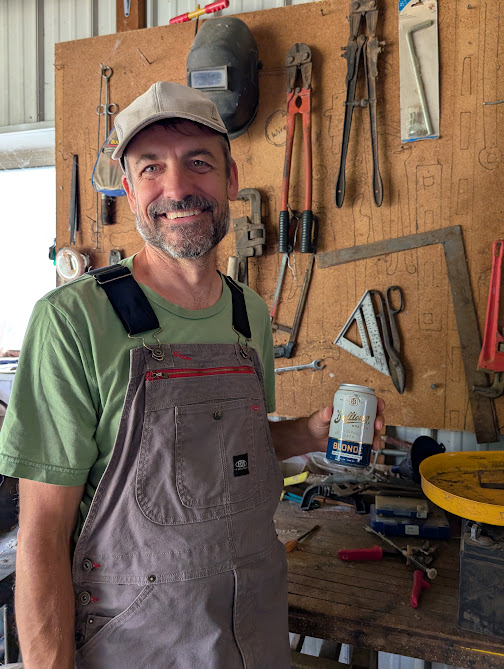 Sam in his workshop, wearing an apron and ready to lend a hand